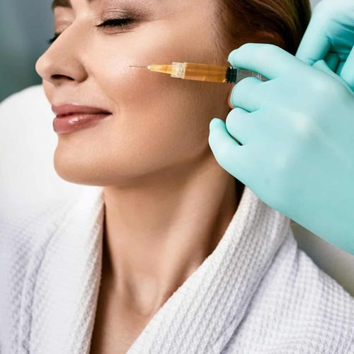 Beautiful woman during facial PRP therapy. Blood plasma injection